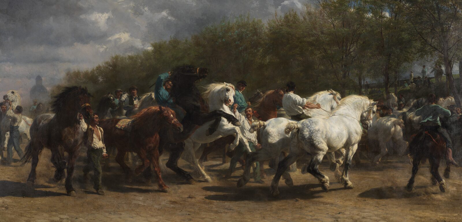 Grooms leading and riding rearing horses at a horse market in Paris