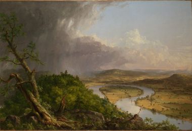 A thunderstorm passing over forest on the left and farmland round a bend of the Connecticut River on the right